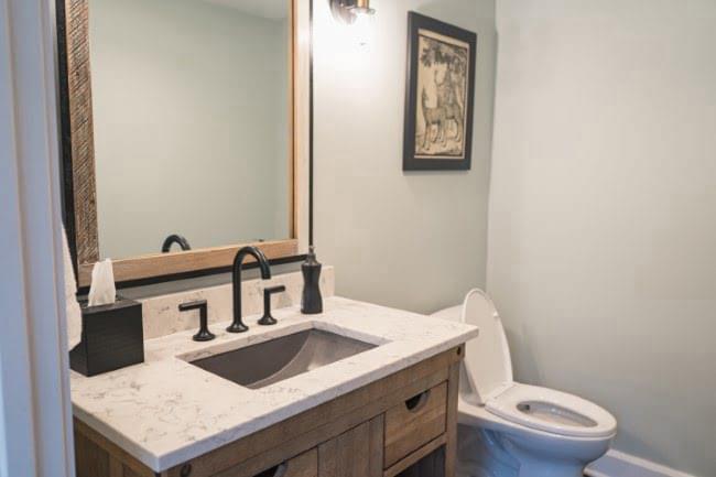 Downstairs half bathroom by the mud room.